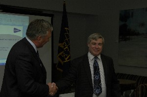 Chapter president John Kirby (l) thanks Linton for serving as the guest speaker in April.